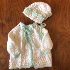 Crocheted cardigan and matching bonnet